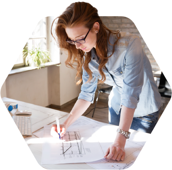 Gordian | Building Intelligence Solutions Fueled by Insights, Technology and Expertise 8 Woman working on construction blueprints